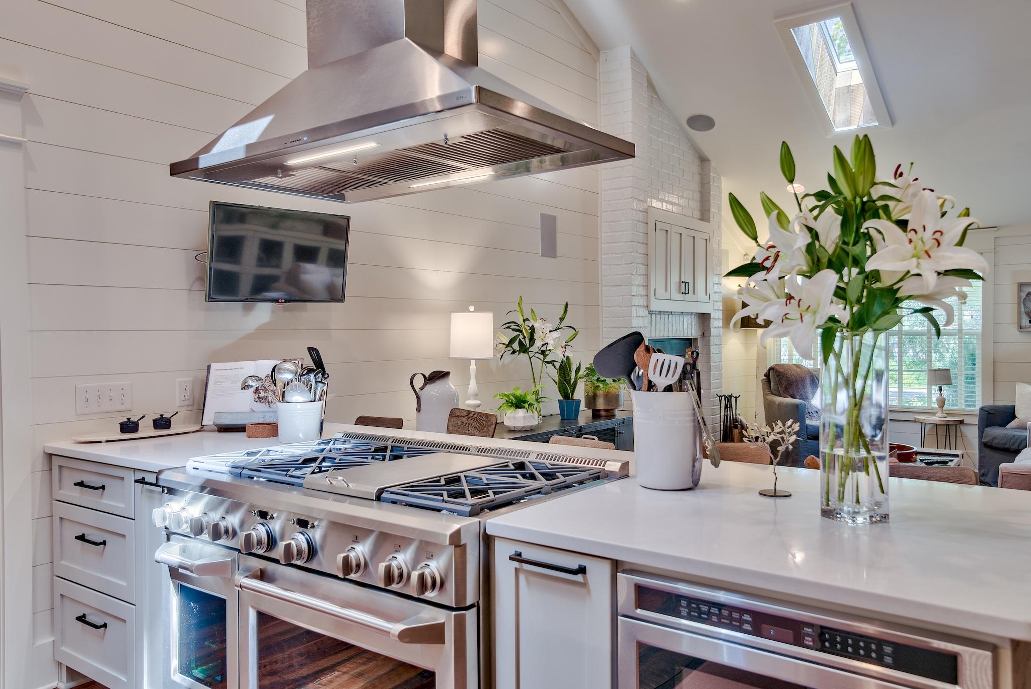 102 Camp Creek Road South Inlet Beach, FL 32461 - Photo 15 of 58 a kitchen with a stove a sink and a table