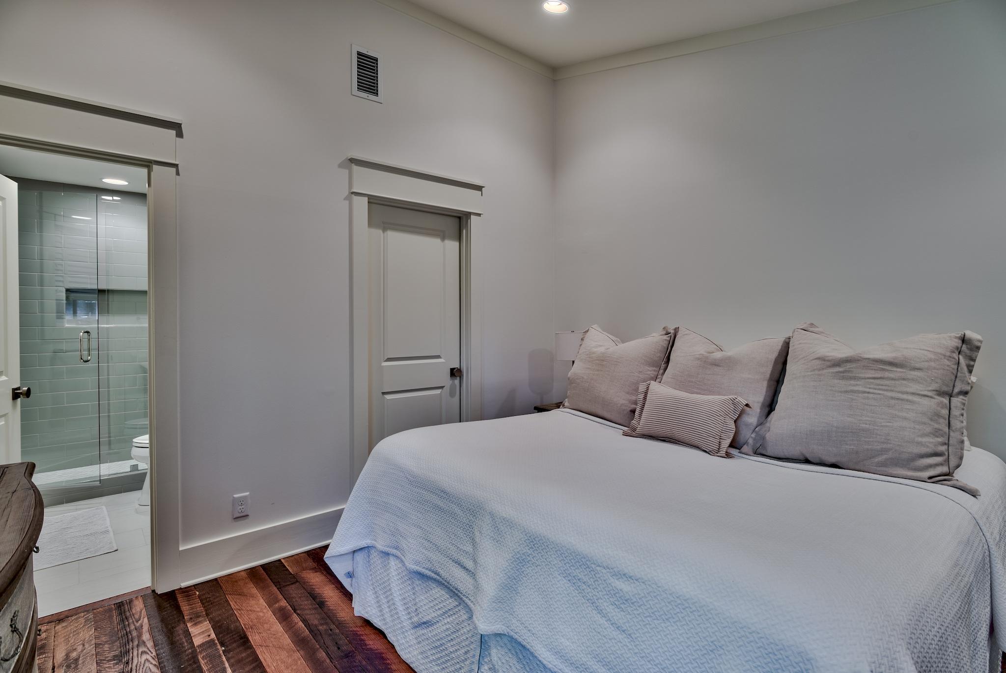 102 Camp Creek Road South Inlet Beach, FL 32461 - Photo 26 of 58 a bedroom with bed and window