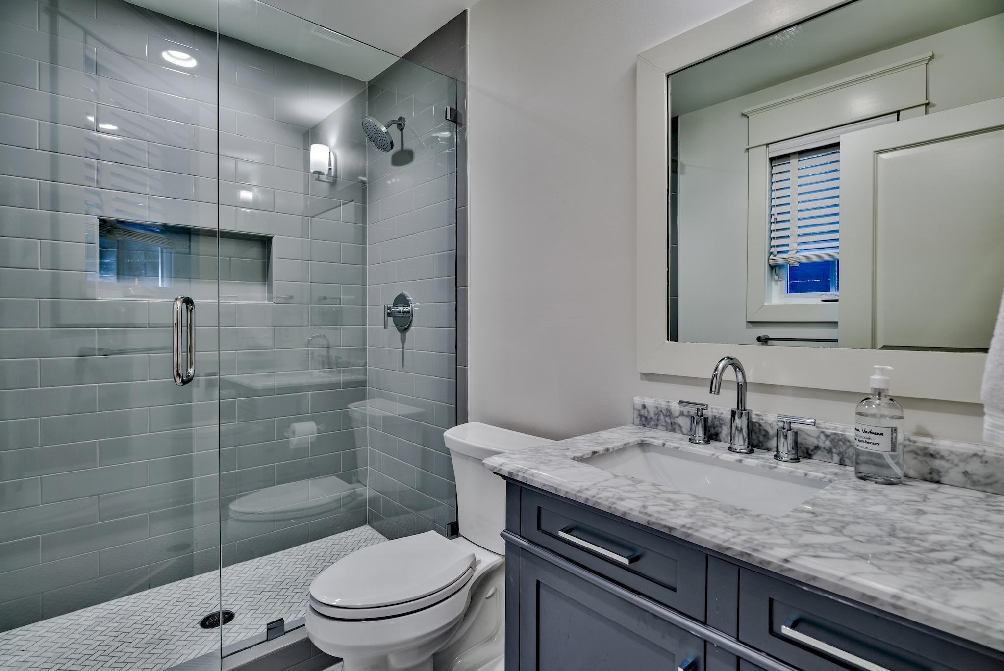 102 Camp Creek Road South Inlet Beach, FL 32461 - Photo 27 of 58 a bathroom with a granite countertop sink a toilet a mirror and shower