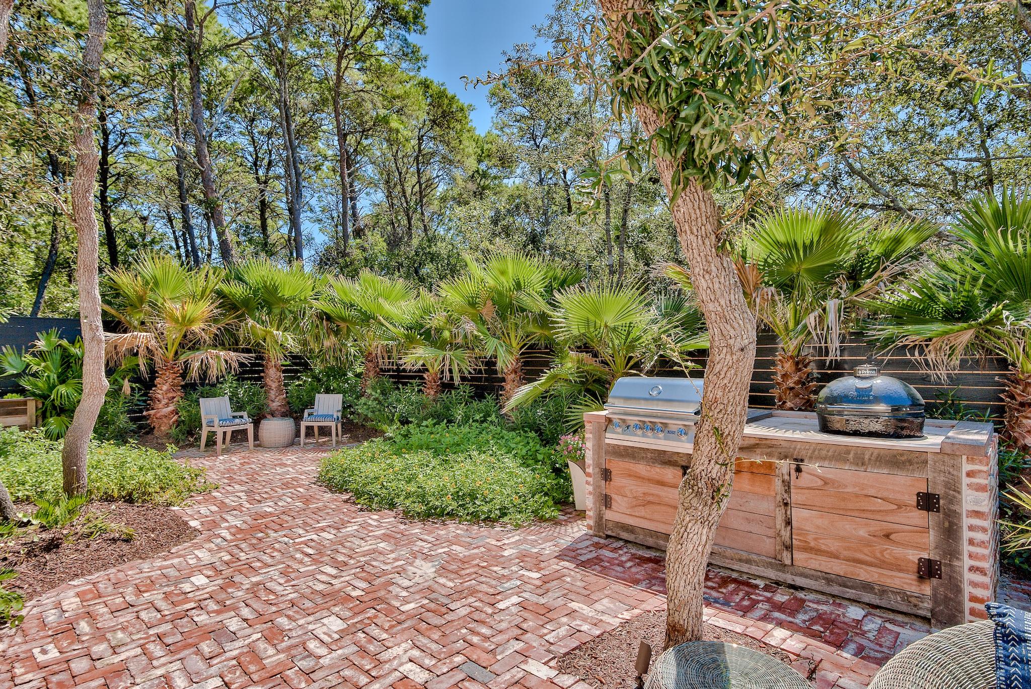 102 Camp Creek Road South Inlet Beach, FL 32461 - Photo 39 of 58 a view of a garden with sitting area