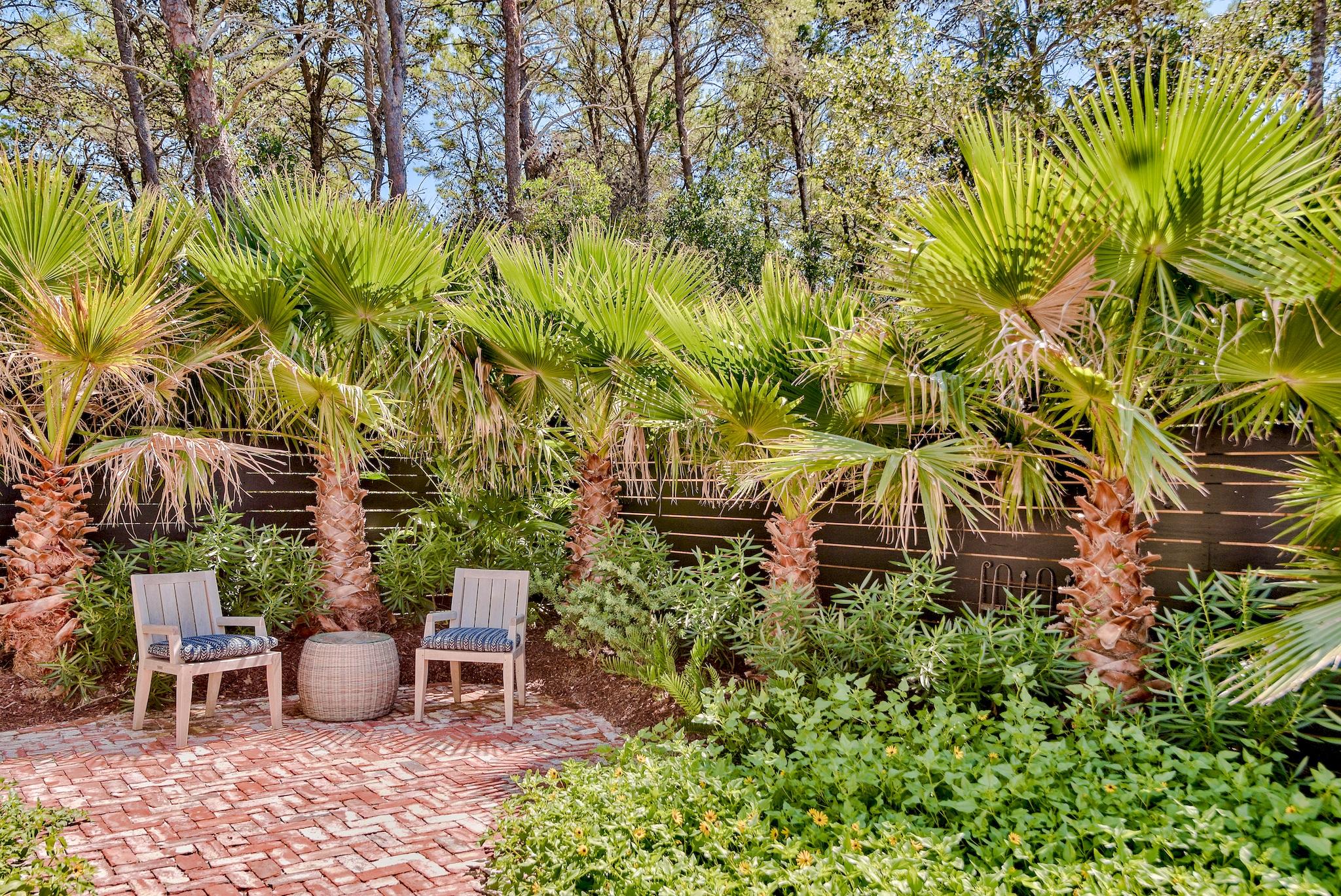 102 Camp Creek Road South Inlet Beach, FL 32461 - Photo 41 of 58 a backyard of a house with table and chairs