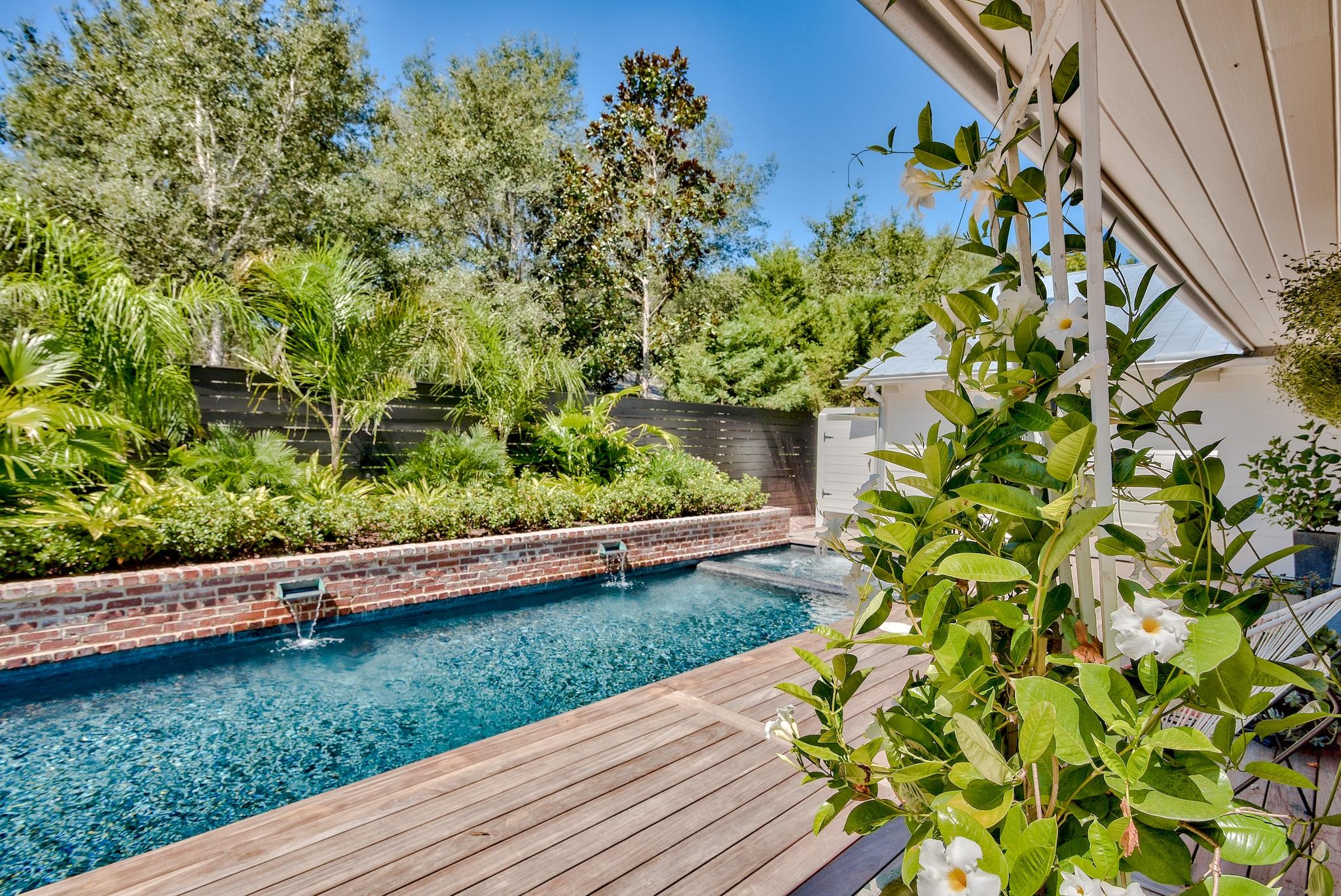 102 Camp Creek Road South Inlet Beach, FL 32461 - Photo 48 of 58 a view of a garden with a bench