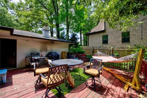 a view of an outdoor sitting area with furniture
