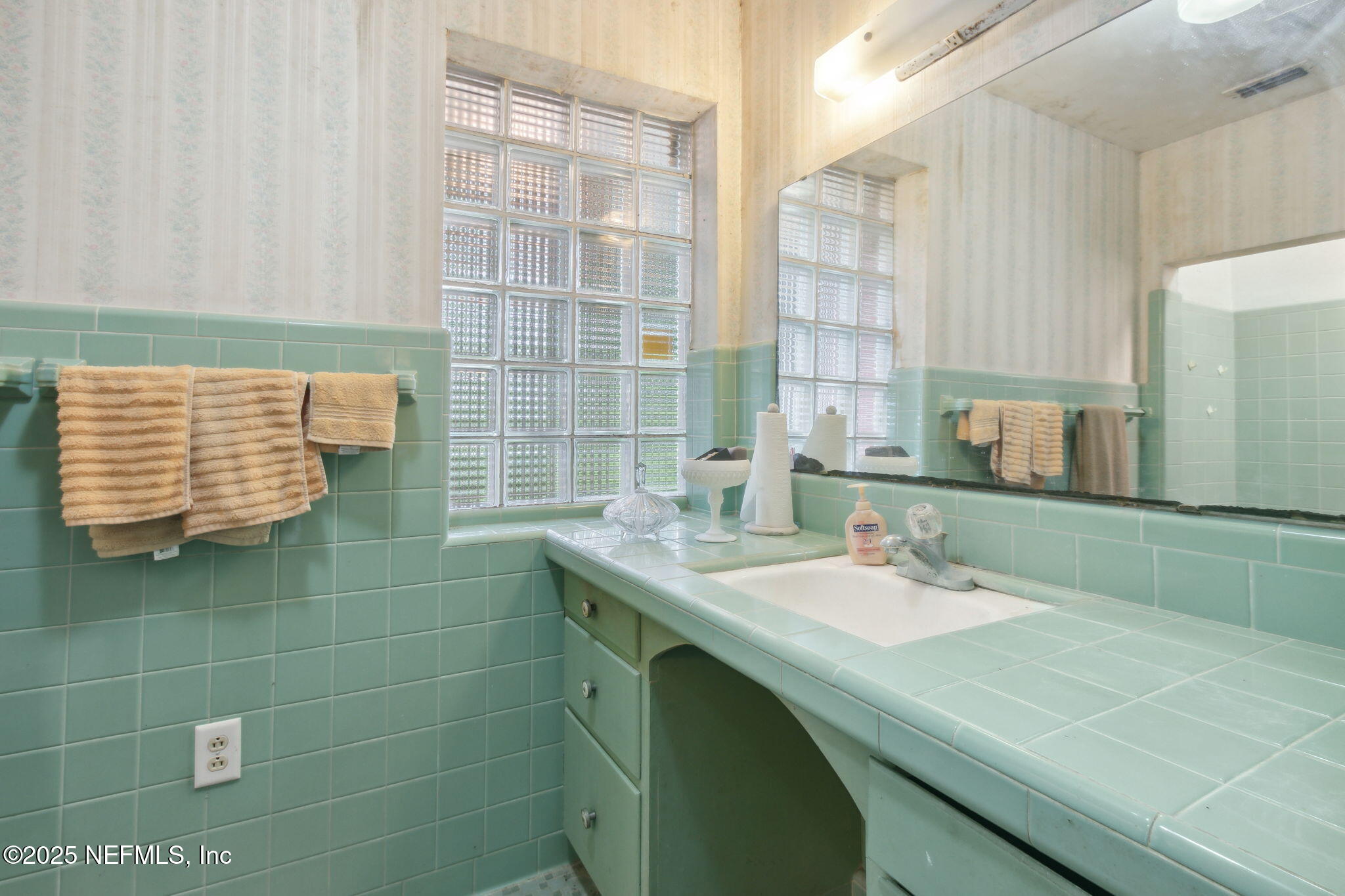 45071 Hodges Road Callahan, FL 32011 - Photo 6 of 18 a bathroom with a sink and a mirror