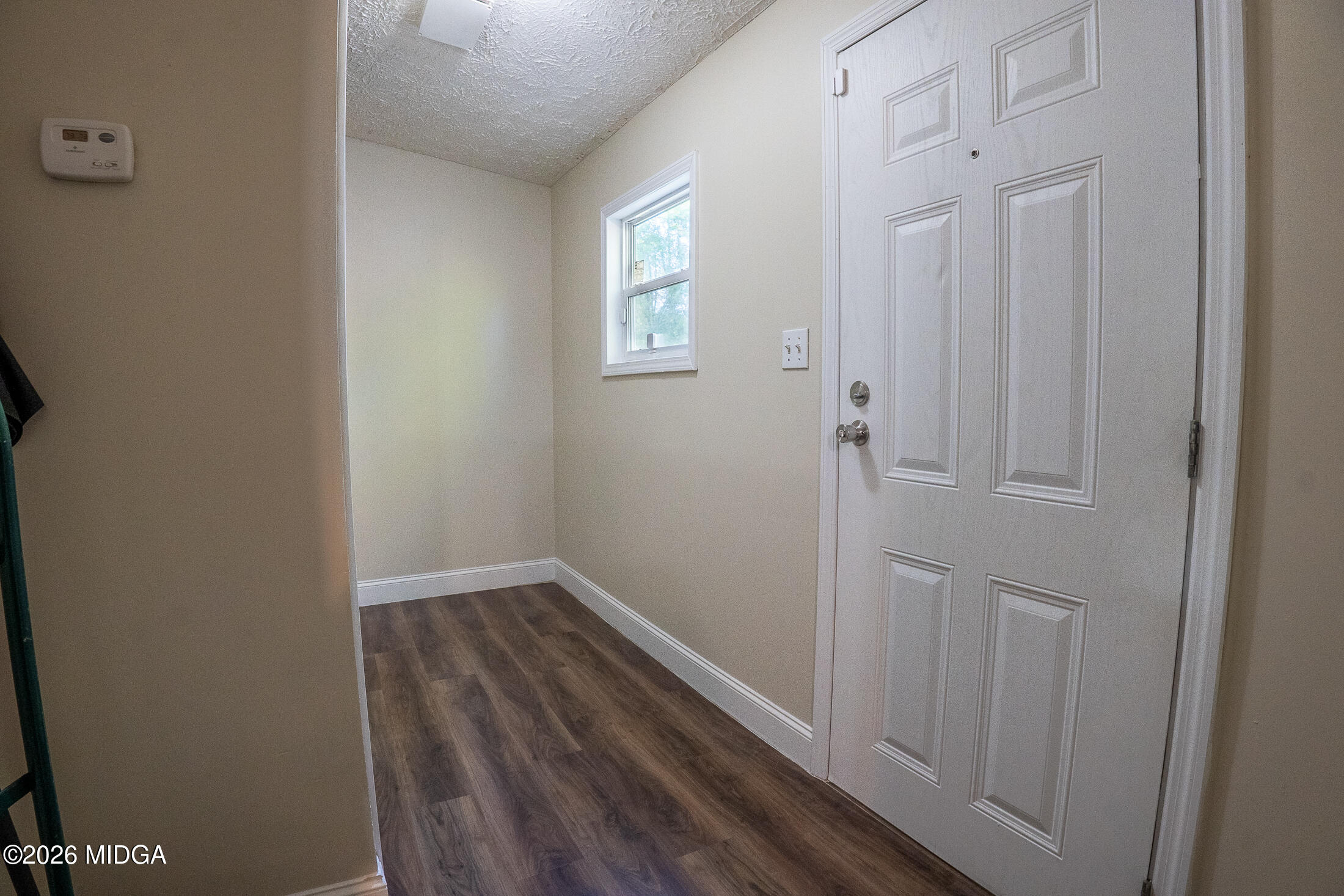 156 Alpine Drive Macon, GA 31206 - Photo 15 of 18 a view of a hallway with wooden floor