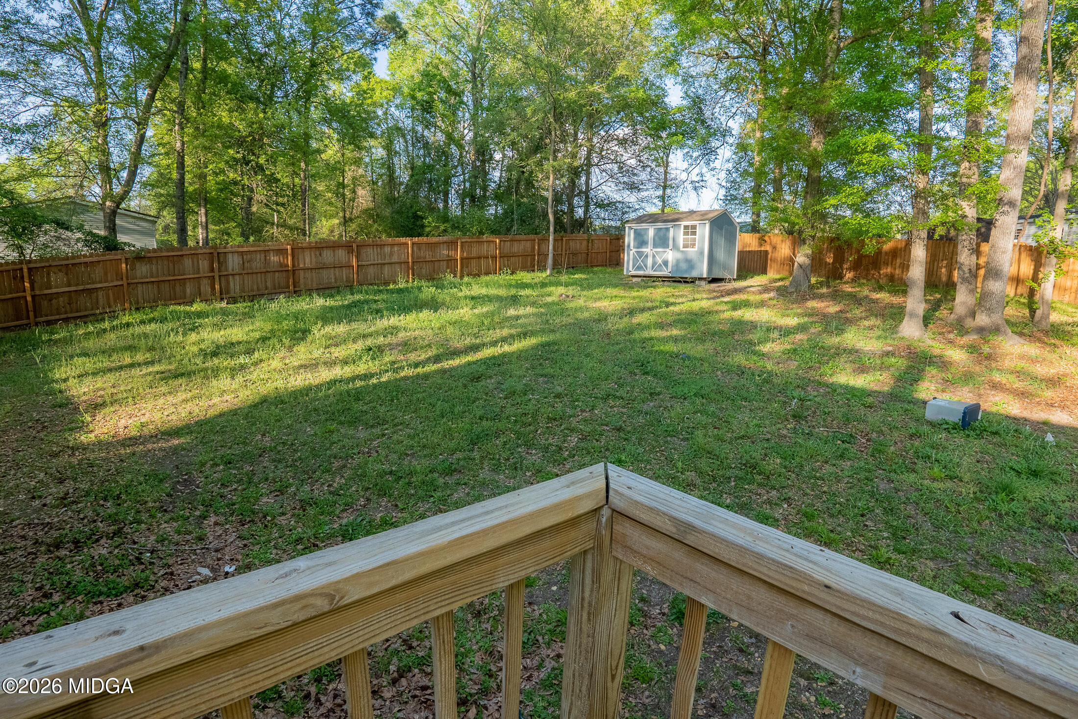 156 Alpine Drive Macon, GA 31206 - Photo 16 of 18 a view of a backyard with a small cabin