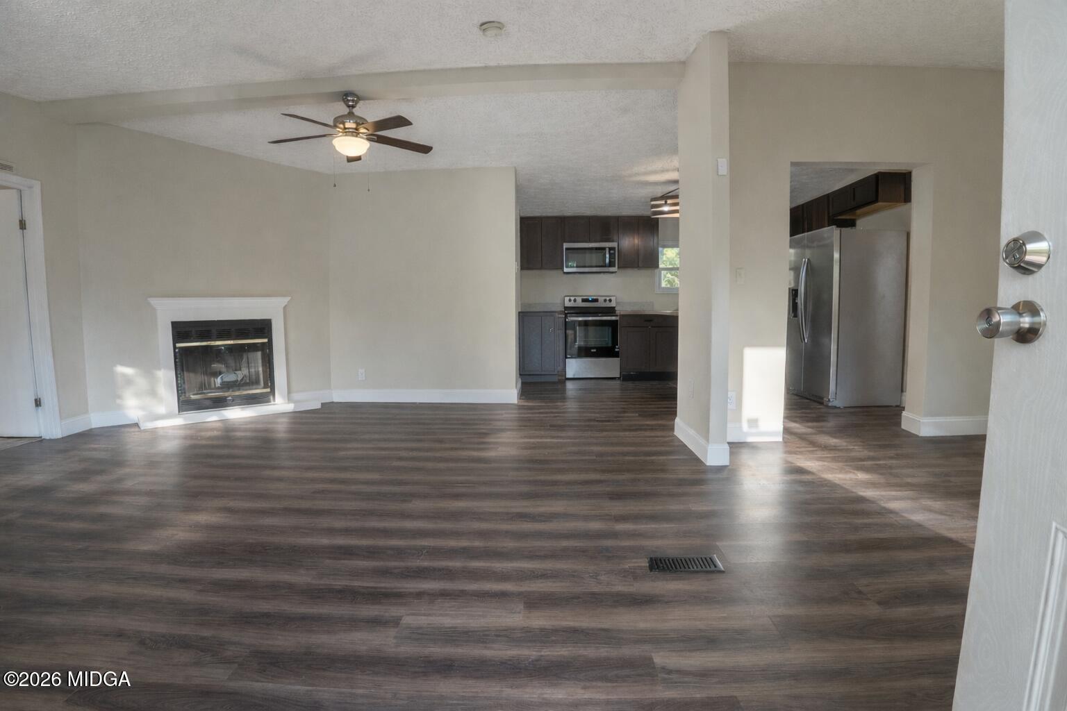 156 Alpine Drive Macon, GA 31206 - Photo 2 of 18 a view of empty room with wooden floor