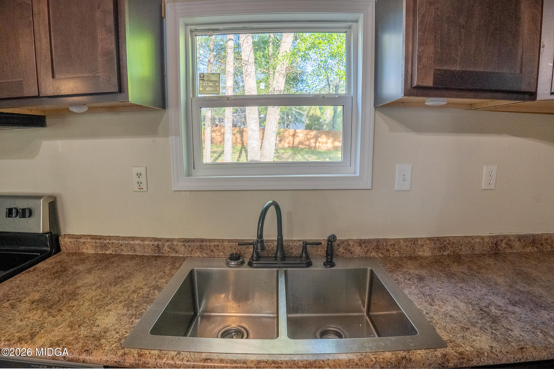 156 Alpine Drive Macon, GA 31206 - Photo 4 of 18 a kitchen with a sink and a window