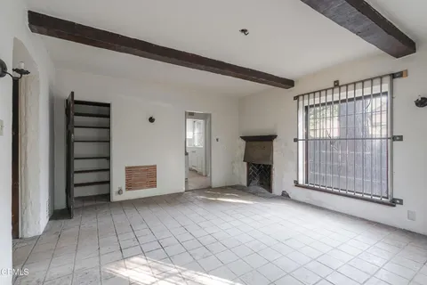 a kitchen with white cabinets and a sink