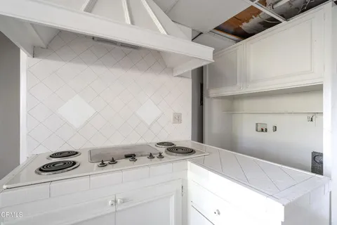 a room with a sink and a mirror