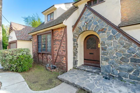 a view of front door of a house with garden