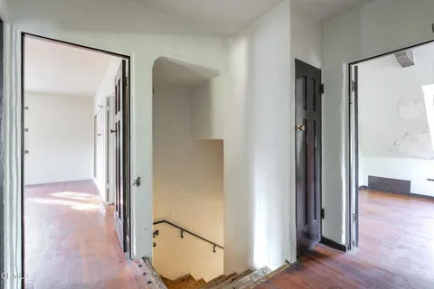 a view of an empty room with stairs