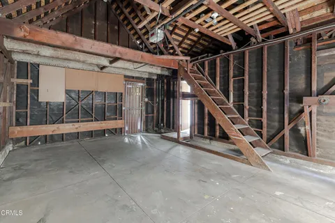 a view of living room with kitchen