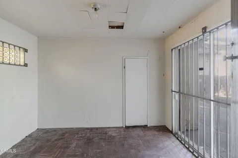 a bathroom with a tub a sink a window and a mirror