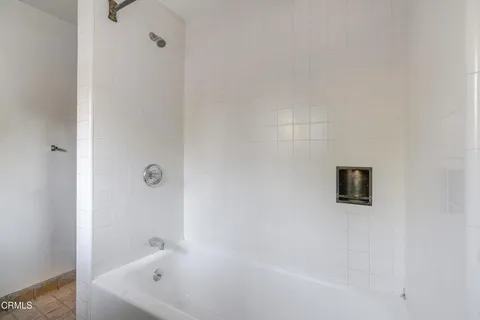 a kitchen with a sink dishwasher a stove and a refrigerator