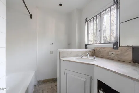 a view of house with outdoor space and swimming pool