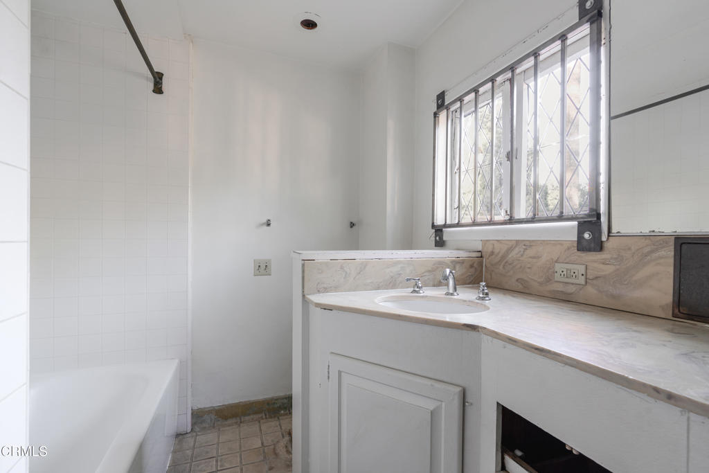 180 West State Street Pasadena, CA 91105 - Photo 42 of 52 a bathroom with a sink a vanity and a bathtub