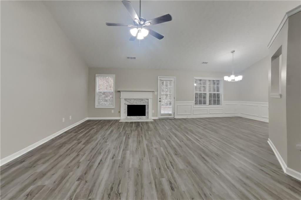 775 James Ridge Drive Lawrenceville, GA 30045 - Photo 2 of 19 a view of empty room with wooden floor and fan