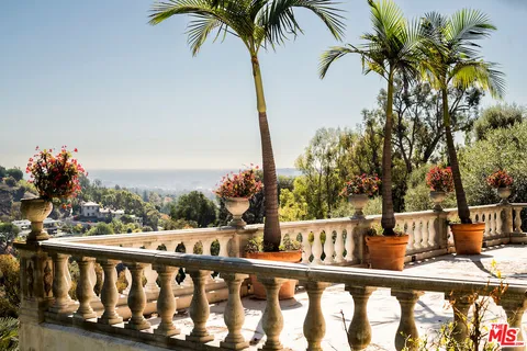 a front view of house with sign board
