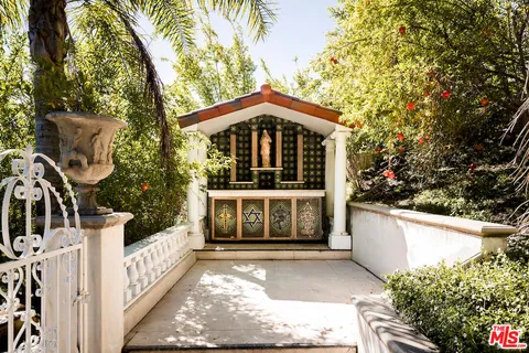 a view of an ocean with large trees