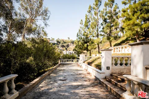 a view of a swimming pool with a yard