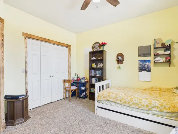 a bedroom with furniture and window