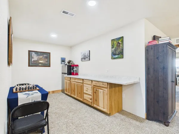 a bedroom with furniture and a wooden floor