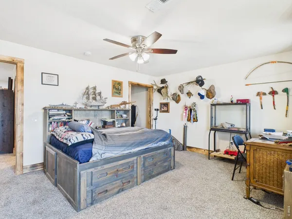a bedroom with furniture and a chandelier