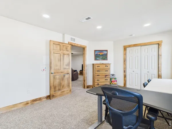 a room with furniture a air conditioner and a window