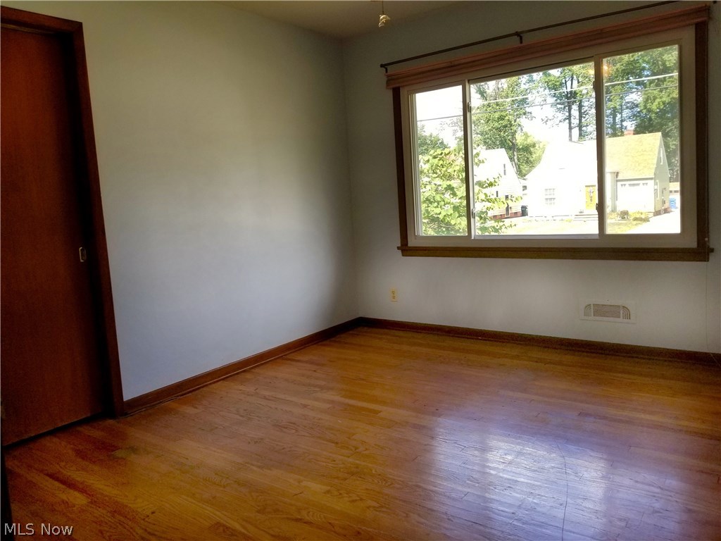 1915 Lorimer Road Cleveland, OH 44134 - Photo 9 of 29 Bedroom one of three with gleaming wood floor