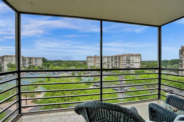 a bedroom with furniture and a rug