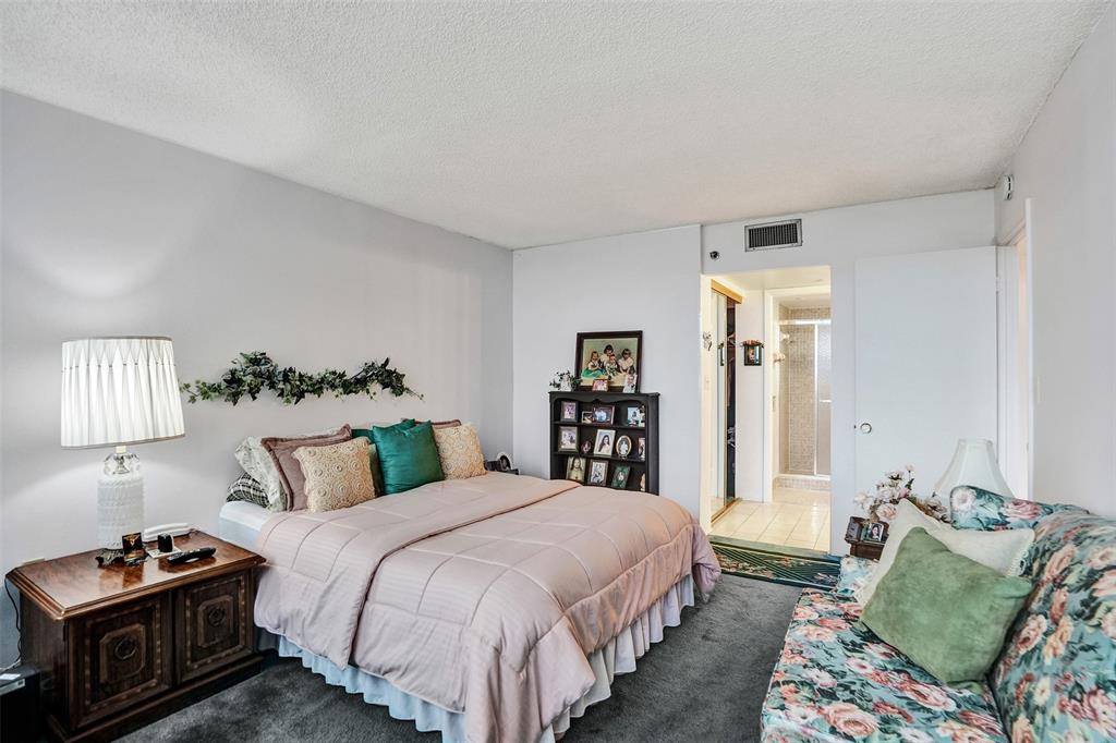 1100 St Charles Place, Unit 612 Pembroke Pines, FL 33026 - Photo 35 of 71 a bedroom with a bed and a window