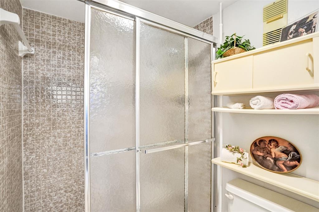 1100 St Charles Place, Unit 612 Pembroke Pines, FL 33026 - Photo 38 of 71 a bathroom with a bathtub and a shower