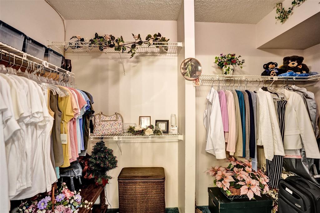 1100 St Charles Place, Unit 612 Pembroke Pines, FL 33026 - Photo 40 of 71 a view of walk in closet with clothes and shoes