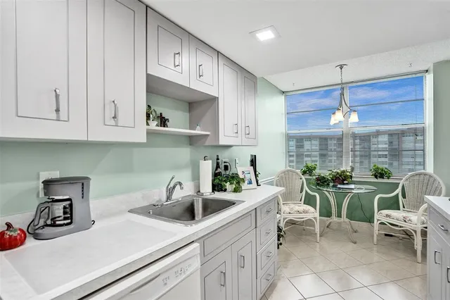 a kitchen with a sink and cabinets