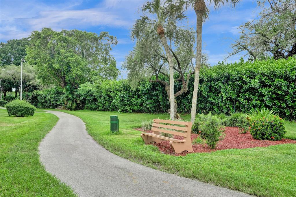 1100 St Charles Place, Unit 612 Pembroke Pines, FL 33026 - Photo 68 of 71 a view of a park with large trees