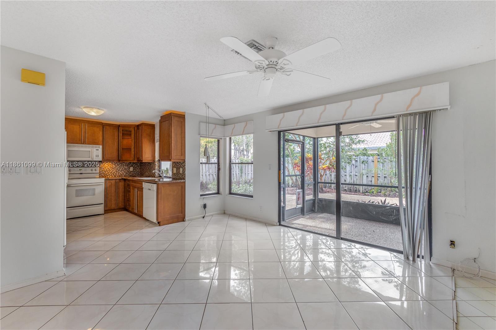 5535 Eton Court Boca Raton, FL 33486 - Photo 16 of 61 a open kitchen with cabinets and stainless steel appliances