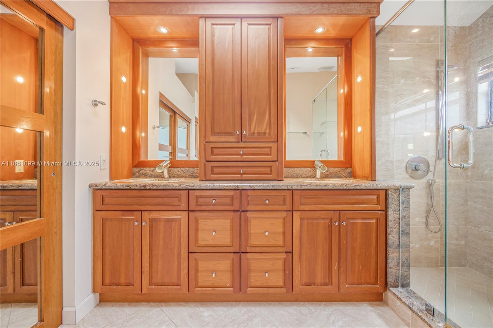 5535 Eton Court Boca Raton, FL 33486 - Photo 34 of 61 a bathroom with a double vanity sink and a mirror