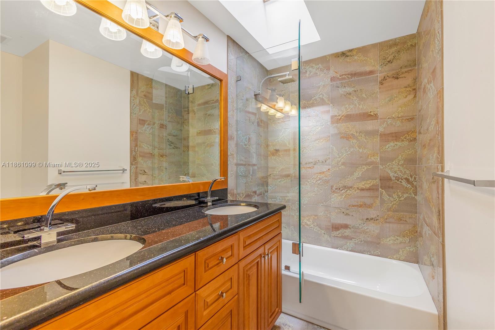 5535 Eton Court Boca Raton, FL 33486 - Photo 37 of 61 a bathroom with a granite countertop sink and a bathtub