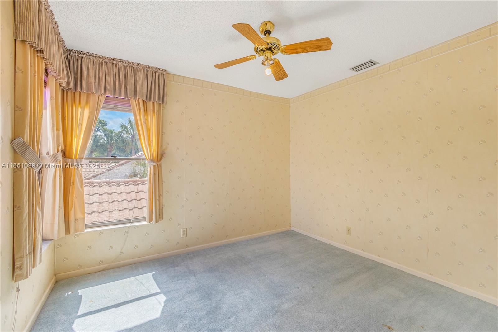 5535 Eton Court Boca Raton, FL 33486 - Photo 43 of 61 an empty room with a window