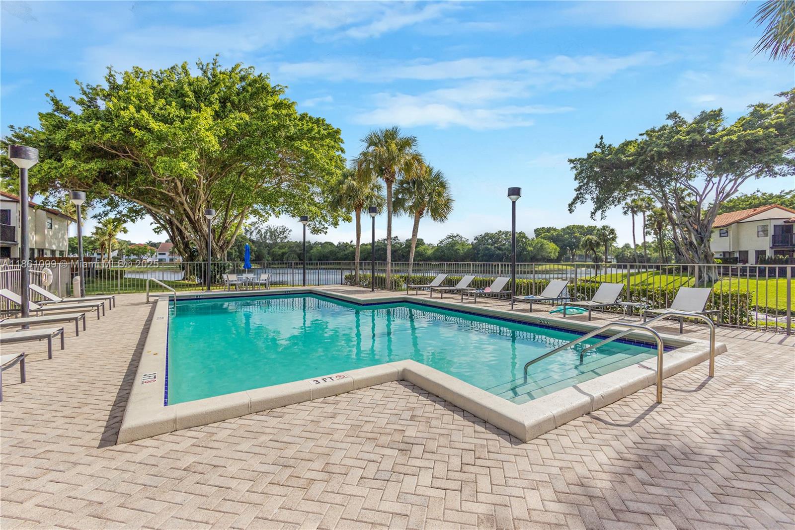 5535 Eton Court Boca Raton, FL 33486 - Photo 48 of 61 a view of a lake with a bench and lake view