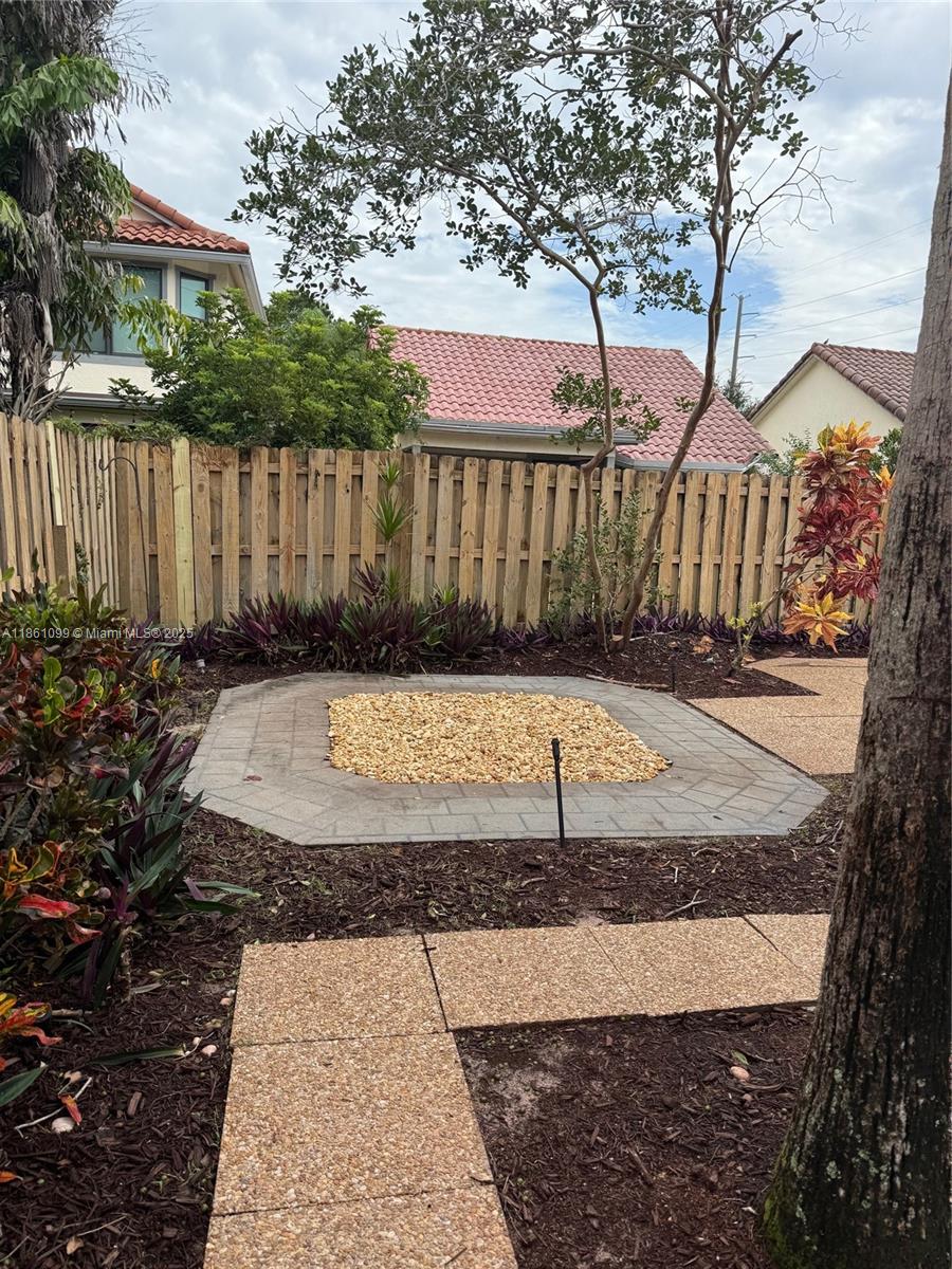 5535 Eton Court Boca Raton, FL 33486 - Photo 51 of 61 a view of a backyard with a house