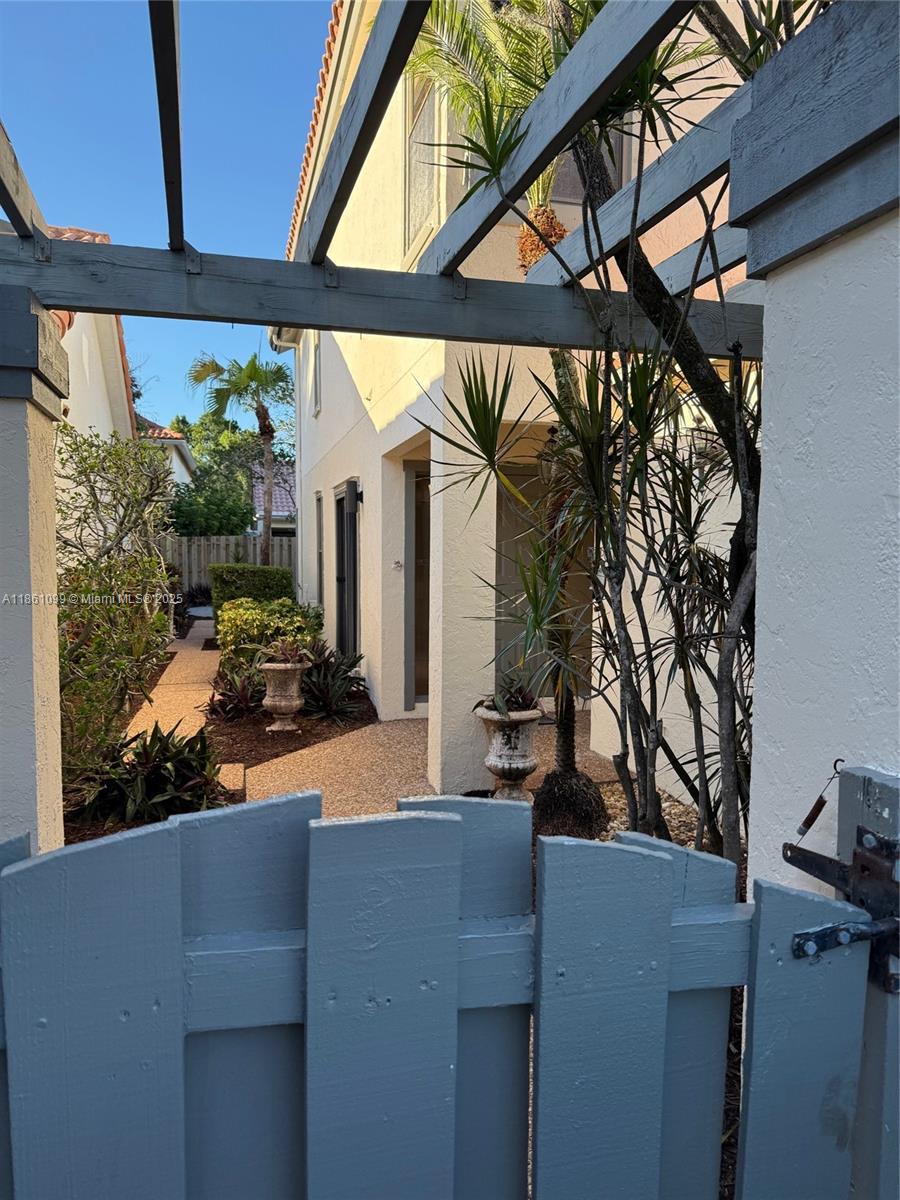 5535 Eton Court Boca Raton, FL 33486 - Photo 61 of 61 a potted plant sitting on the outside of a building