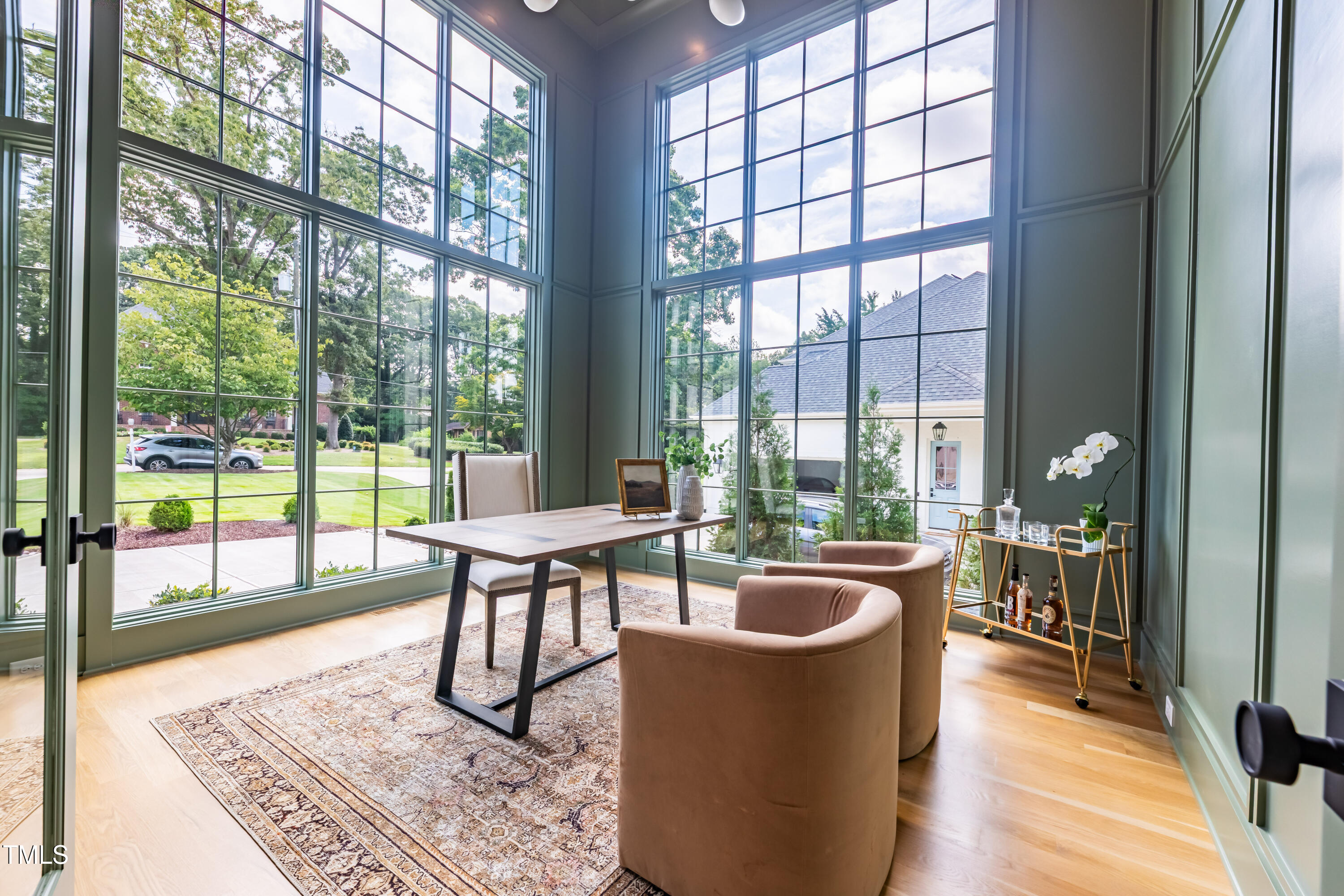 2227 Wheeler Road Raleigh, NC 27607 - Photo 9 of 56 a living room with furniture and a floor to ceiling window