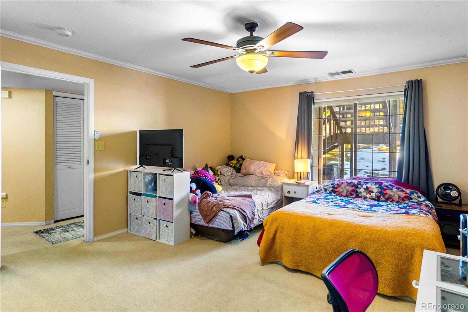 2170 Alicia Point, Unit 102 Colorado Springs, CO 80919 - Photo 18 of 37 a bedroom with bed and window