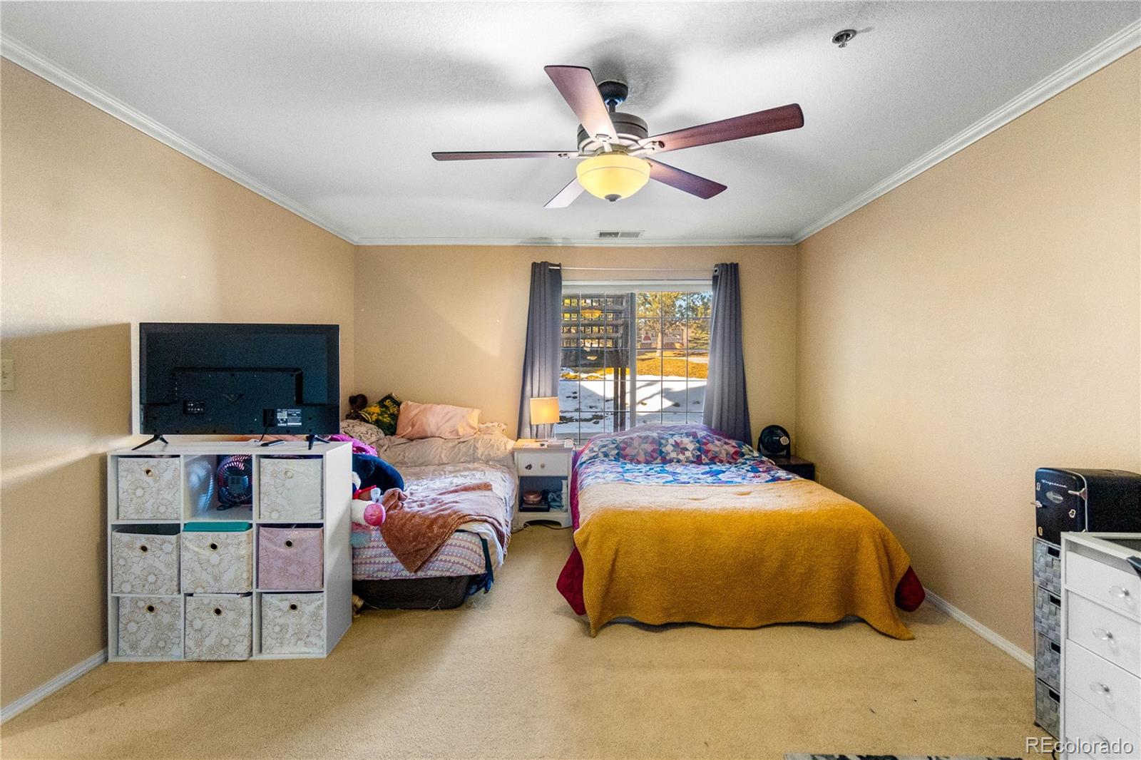 2170 Alicia Point, Unit 102 Colorado Springs, CO 80919 - Photo 19 of 37 a bedroom with bed and tv