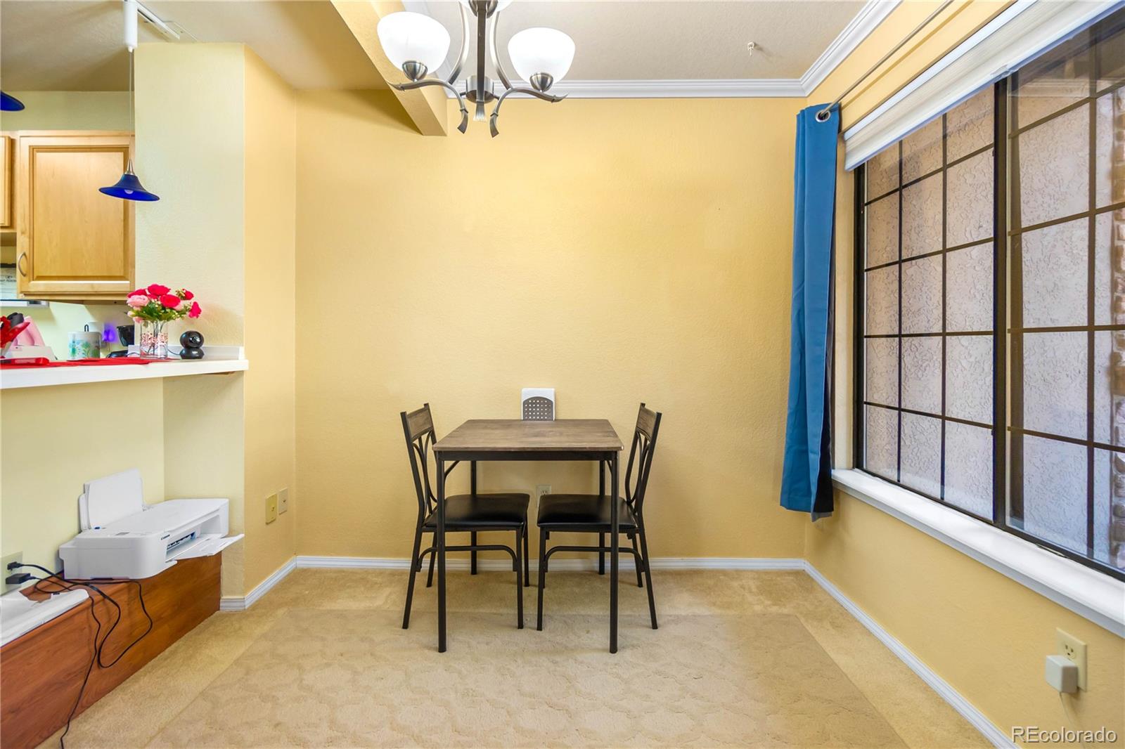 2170 Alicia Point, Unit 102 Colorado Springs, CO 80919 - Photo 10 of 37 a dining room with furniture and a potted plant