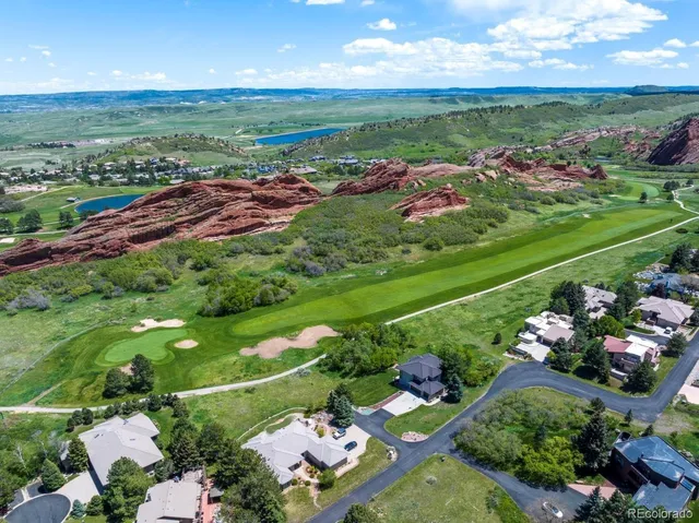 a view of a bunch of flowers in front of house