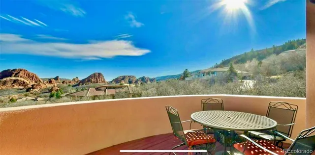 a view of a balcony with chairs