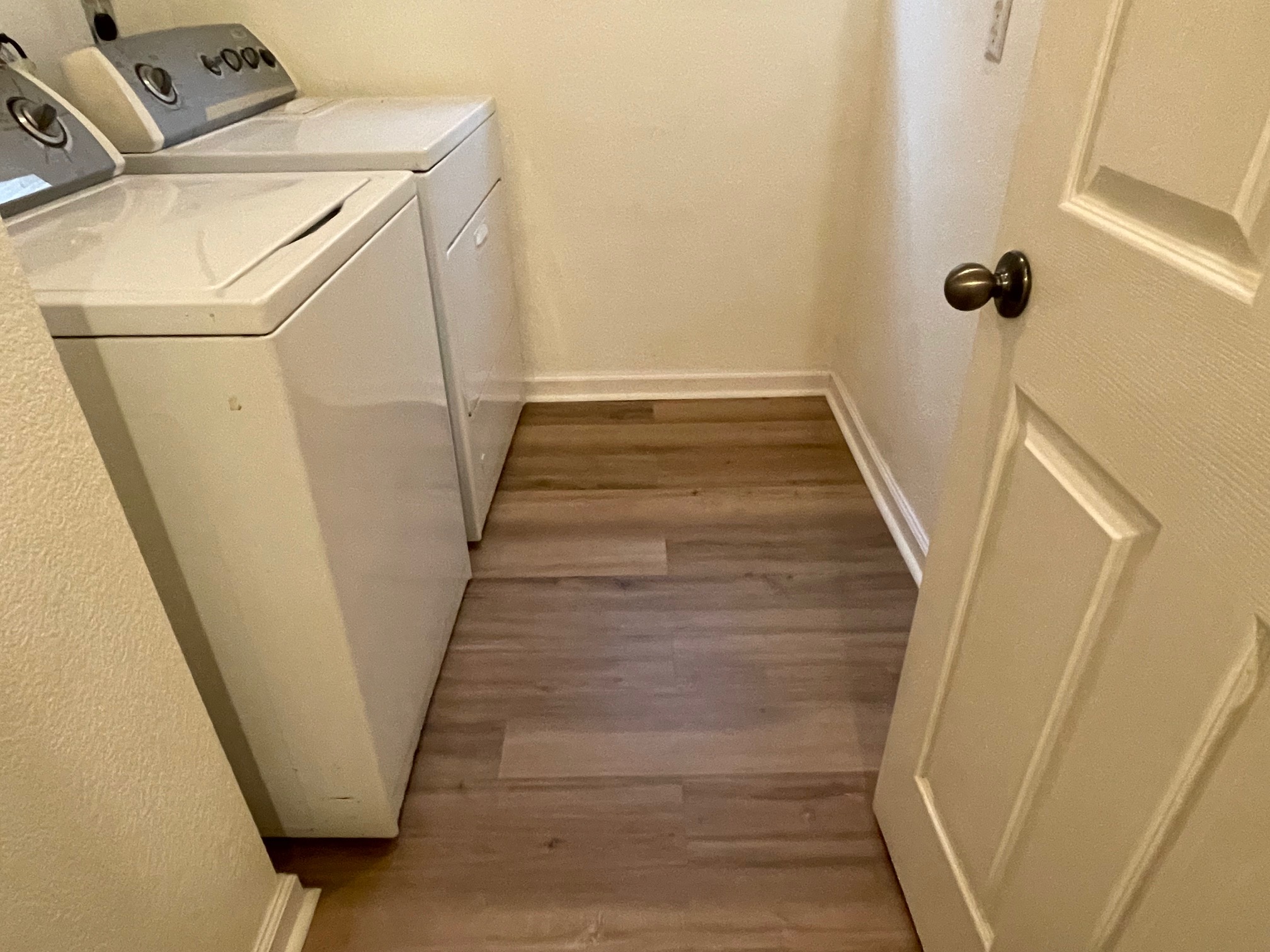 1000 Berry Bend Path Round Rock, TX 78664 - Photo 13 of 20 Functional laundry space featuring durable wood flooring and essential appliances.